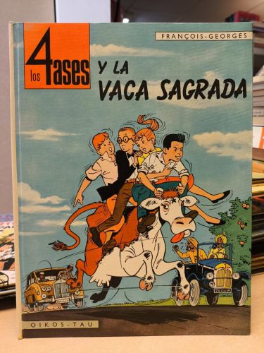 Portada del libro de LOS 4 ASES Y LA VACA SAGRADA -OIKOS-TAU 1ª EDICION 1968 TAPA DURA
