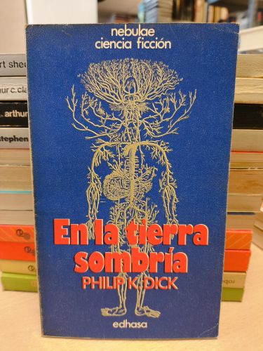 Portada del libro de EN LA TIERRA SOMBRÍA - PHILIP K. DICK - EDHASA NEBULAE 1978
